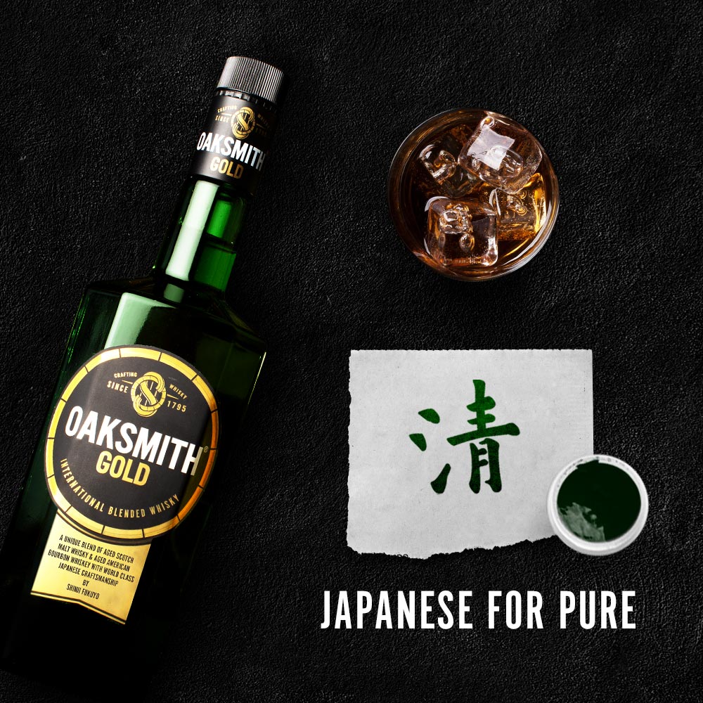 oaksmith premium whisky oaksmith gold bottle with gold written in japanese on table top